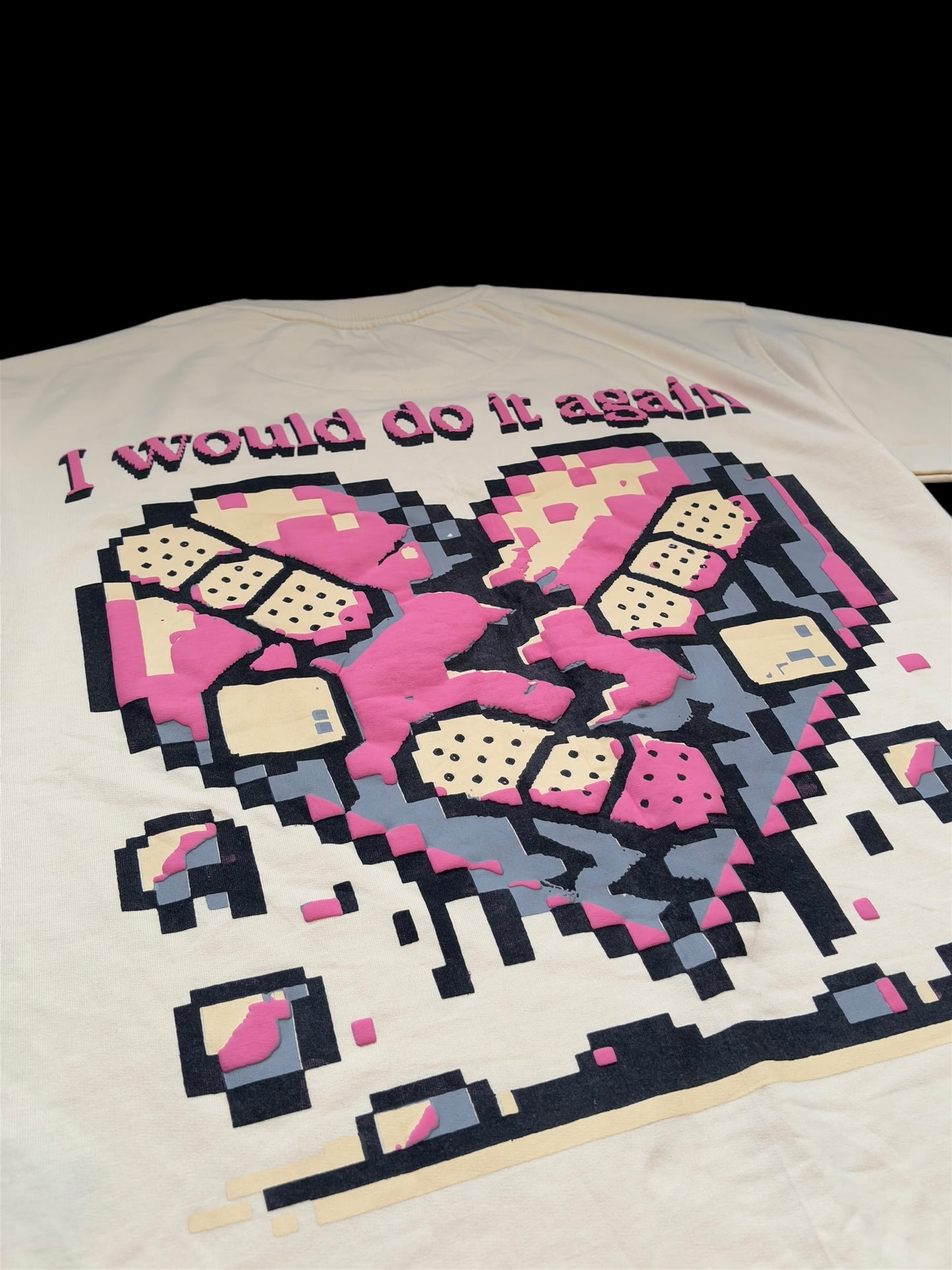Close-up of Imerno’s “I Would Do It Again” t-shirt – embroidered pixel heart design from a limited edition Gen Z streetwear drop by one of India’s rising fashion brands.